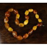A Yellow & Butterscotch Amber Bead Necklace 16¼" (41 cm) in length.