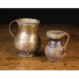 Two Early Tankards: An 18th century tinned copper baluster tankard with rivetted handle 5¼" (13.