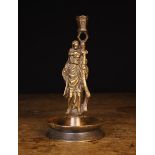A 19th Century Cast Bronze Figural Candlestick in the 16th century style.