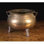 A 17th Century Bronze Cauldron with sheet brass repairs to the rim,