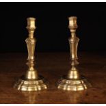 A Pair of 18th Century French Gilt Brass Candlesticks.