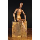 A Small Vintage Treen Lay Figure with fully articulated body and a feature-less face,