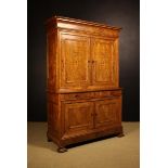 An Antique French Figured-Elm Housekeeper's Cupboard composed of fine book-matched solid timbers