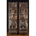 A Pair of 17th Century Oak Muntins mounted with carved terminals each depicting an atlante with