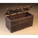 A 16th Century Wrought Iron Strong Box of rectangular form bound in studded straps.