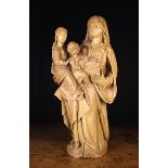 A Flemish Oak Figure Group Carving "Anna te Drieën",