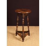 A Small Oak Lamp/Occasional Table having a round top on three twinned baluster turned legs united