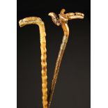 Two Carved Rustic Walking Sticks: One having a knobbly stem and integral handle fine carved with a