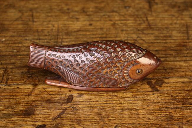 A Late 19th Century Treen Snuff Box in the form of a fish with chip carved scales,