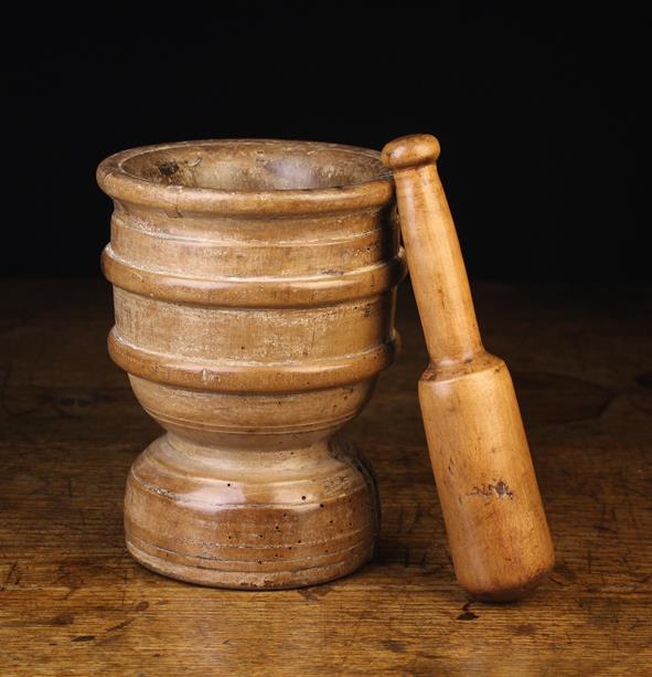 A 17th Century Turned Beechwood Pestle & Mortar. The pestle 9½" (24 cm) in length.