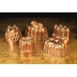 A Group of Five Decorative Victorian Copper Jelly Moulds, including three by Benham & Froud,