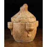 A Fine Italian Romanesque Stone Holy Water Font with original radial fluted lid surmounted by a
