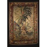 An Early 18th Century Tapestry Wall Hanging depicting a young man with basket of flowers and dog by