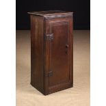 A Small 18th Century Provincial Oak Standing Cupboard having boarded sides and a joined framework
