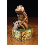 A Vintage Tin Plate Mechanical Money Bank in the form of a monkey holding a coin dish;