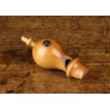 A 19th Century Treen Bird Whistle of turned boxwood with an acorn finial to the end of the baluster