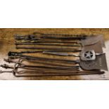 A Collection of 19th Century Fire Tools: Five pairs of tongs, three shovels, a spatula and a poker.