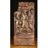 A 16th Century Oak Fragment Relief Carving depicting a figure group;