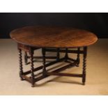 A Large 17th Century Oak Gateleg Table.
