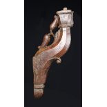 A 16th Century Carved Architectural Fragment with residual paintwork: A bracket carved with a