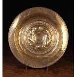 An 18th Century Brass Repoussé Alms Dish.