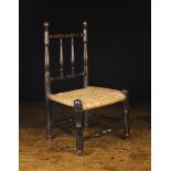 A Delightful 19th Century Rush-seated Doll's Chair with residual ebonising.