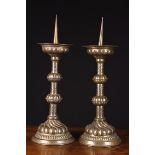 A Pair of Antique Repoussé Brass Pricket Sticks.