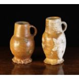 Two 15th Century Siegburg Jugs with ring turned bodies and crimped feet,