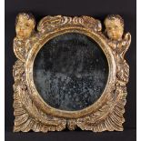 An 18th Century Spanish Carved, Polychromed & Gilded Frame containing a later mirror.