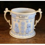 A Large 19th Century Loving Mug sprigged with pale blue glazed relief moulded decoration and