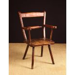 A Small 19th Century Country Armchair with traces of red paint.