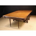 A 19th Century French Walnut Extending Dining Table.