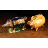 Two 19th Century Ceramic Piggy Banks: One daubed in blue and brown glaze on a mottled green glaze