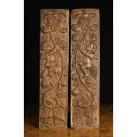 A Pair of Late 17th/Early 18th Century Oak Panels relief carved with cherubs climbing scrolling