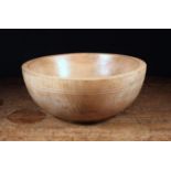 A Turned Treen Dairy Bowl, 6¼" (16 cm) high, 14¾" (37.5 cm) in diameter.