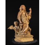 A 16th Century & Later Wood Carving of Saint Martha and the Tarasque with traces of residual