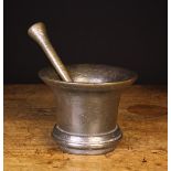 A Large 17th Century Dark Patinated Bronze Mortar with wide flared rim and stepped foot for