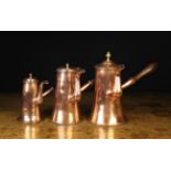 A Group of Three 18th Century Copper Hot Chocolate Pots each with a with turned wooden side handle,