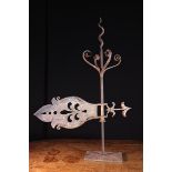 A Rare 17th Century Wrought Iron Weather Vane having a corkscrew finial centring four ornamental