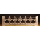 A Pierced Oak Architectural Fragment Rail carved with Gothic flowers and arcading,