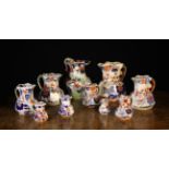 A Group of Ten Graduated Ironstone China Jugs decorated with 'Japanese basket' design in