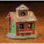 A Rare Painted Cast Iron Money bank in the form of a lodge with coin slot to the dormer above an