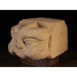 An Architectural Stone Carving of a Green man, probably medieval, 7" (18 cm) high,