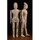 A Pair of 19th Century Southeast Asian Carved Wooden Male & Female Figures with articulated limbs