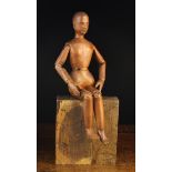 A Small Late 19th Century Pine Lay Figure with articulated limbs and body, a carved face,