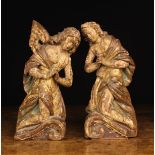 A Pair of 18th Century Carved & Polychromed Wooden Pediment Figures of curly haired angels wearing