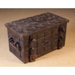 A 16th/17th Century Wrought Iron Strongbox or Armada Chest bound in studded straps and painted with