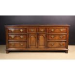 A Fine Early 18th Century Oak Enclosed Welsh Dresser of rich colour & patination.