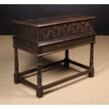 A 17th Century Joined Oak Box on Stand The rectangular lid having a moulded edge and original iron