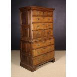 An 18th Century Oak Chest on Chest with panelled sides.